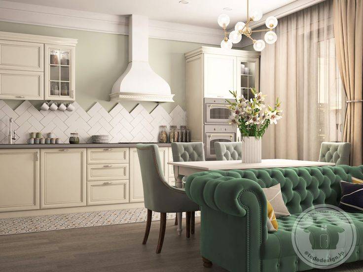 Дизайн кухни-гостиной с зеленым диваном
